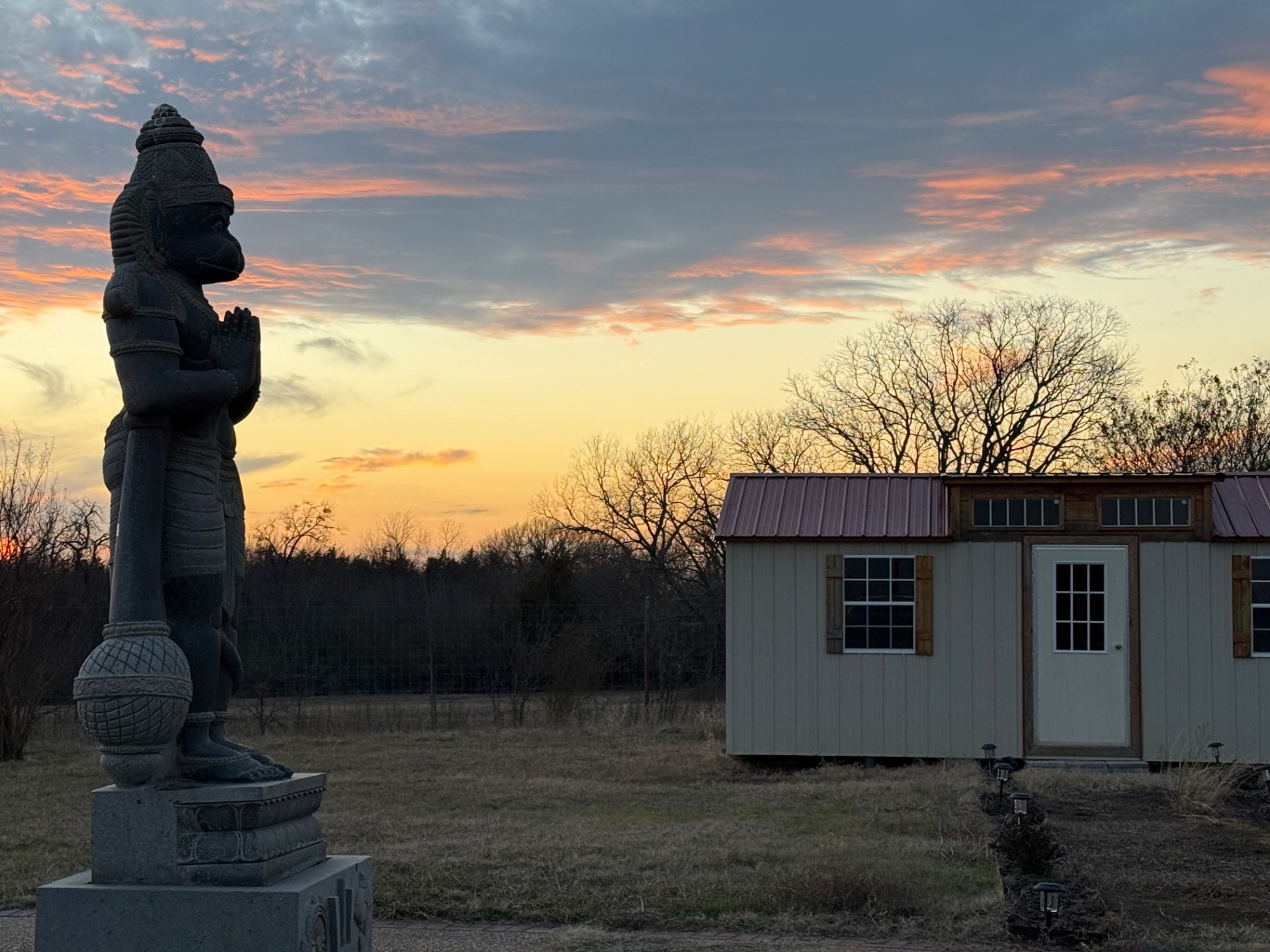 The Mandir at dusk, watched over by Hanuman-ji